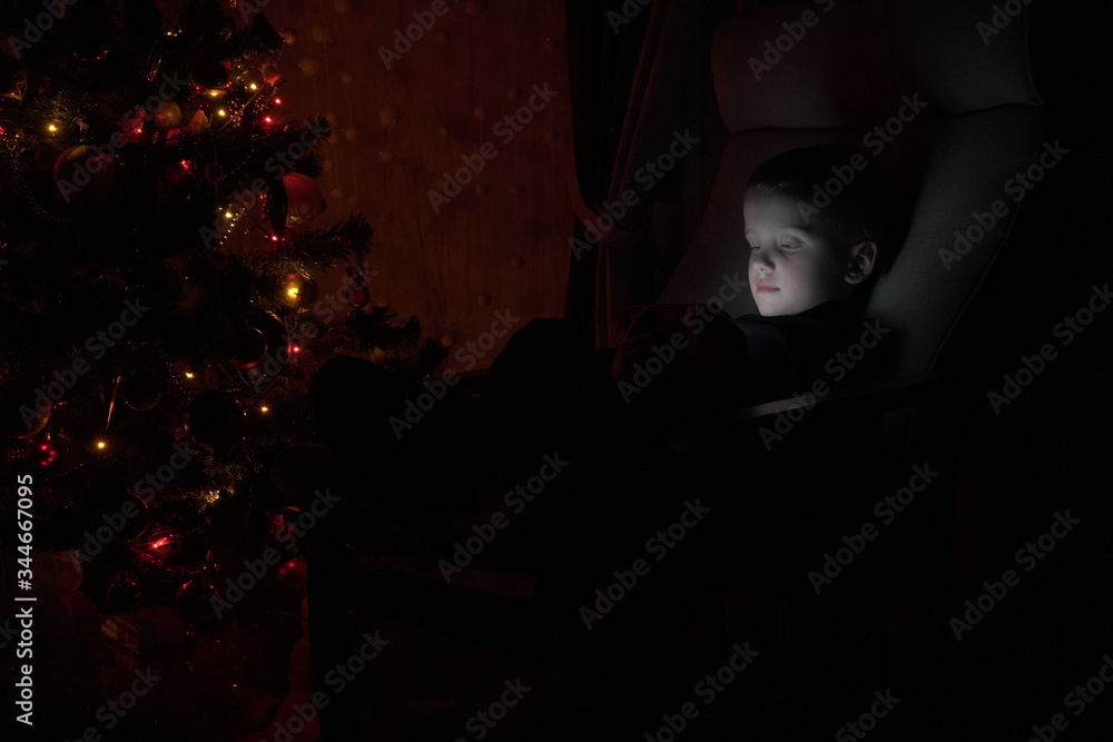 Young boy looking on laptop at home lying on bed. Teenage child using computer . Teenager is typing on laptop keyboard at afternoon . Real time. 4k footage. Young boy looking on laptop at home lying on bed. Teenage child using computer . Teenager is typing on laptop keyboard at afternoon . Real time. 4k footage.