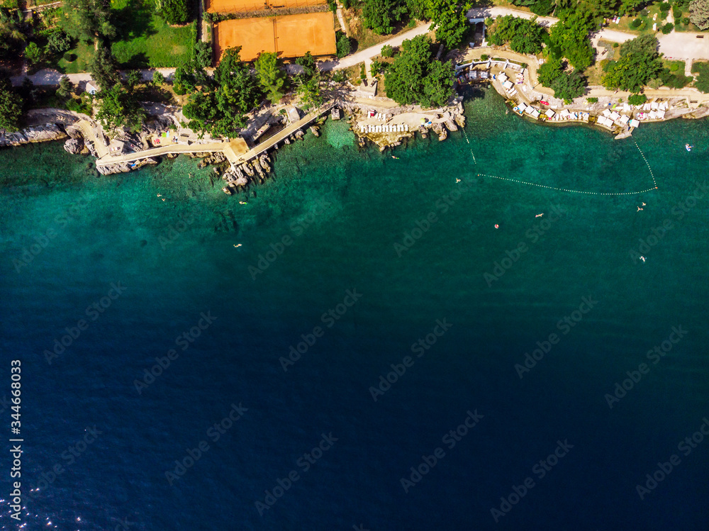 Beautiful panoramic view of Lovran village and its sea shore in Croatia. Top view photo taken on drone.