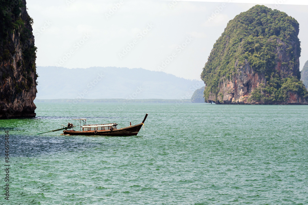 Traditional Thai longtail boats in the Andaman sea.