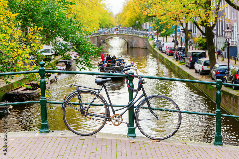 bicycles leaning at a bridge railing in Amsterdam, Netherlands