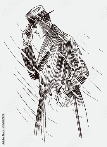 Mid aged man from the early 20th century walking through wind whipped rain, wearing coat and holding his hat against the wind