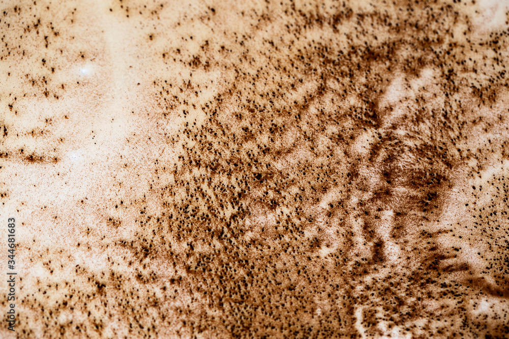 Abstract coffee background with coffee stains and rough edges. Liquid coffee textured surface with drops. Abstract coffee background with coffee stains and rough edges. Liquid coffee textured surface with drops.