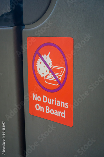 SINGAPORE, SINGAPORE - FEBRUARY 01, 2018: Indoor view of informative sign of no durians on board sticker inside of public transport in Singapore photo