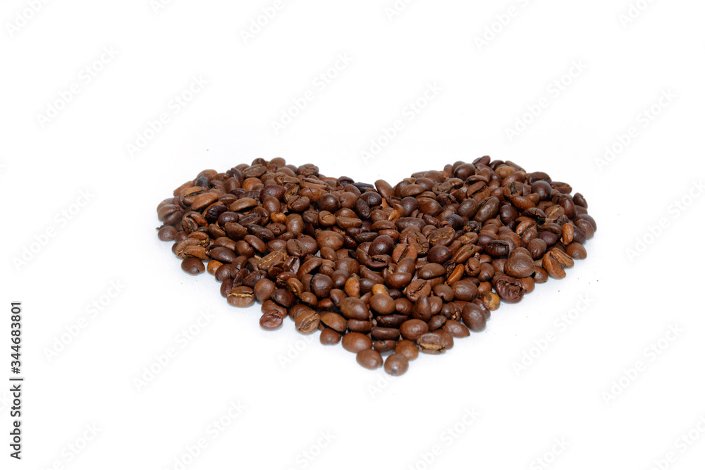 heart on a white background made of coffee beans. heart on a white background made of coffee beans.