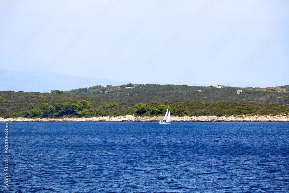 Sailing boat on the sea in southern Dalmatia region in Croatia. Beautiful landscape and bright summer day. Sailing boat on the sea in southern Dalmatia region in Croatia. Beautiful landscape and bright summer day.