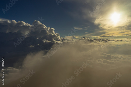 Views to the clouds from Kerinci volcano summit many sulphur gas around coming from the crater depths Sumatra, Indonesia photo