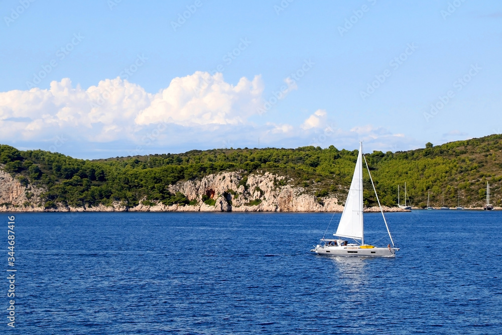 Obraz premium Sailing boat on the sea in southern Dalmatia region in Croatia. Beautiful landscape and bright summer day.