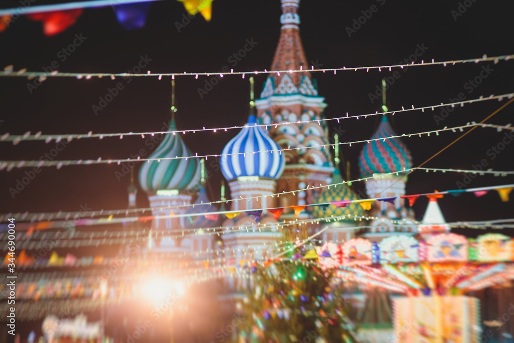 Moscow streets with New Year decoration, Christmas illumination on the Red Square, with Christmas market fair, with Saint Basil's Cathedral, Russia