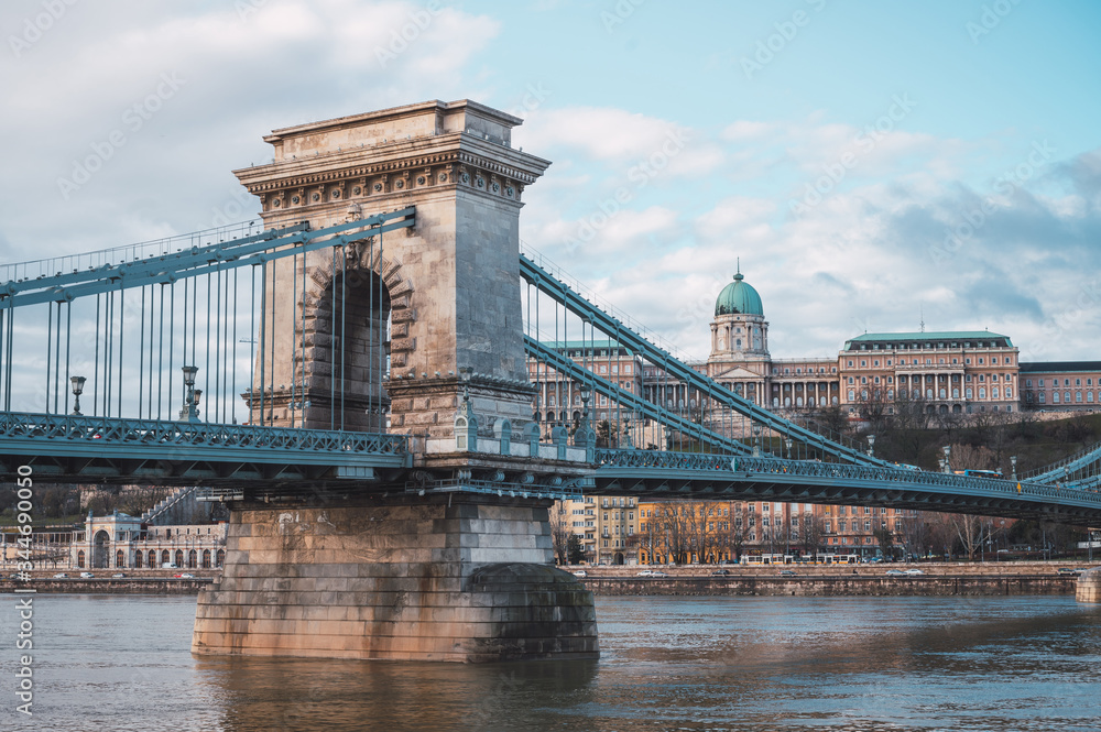 Chain bridge on the Danube river in Budapest, in the background the Buda castle