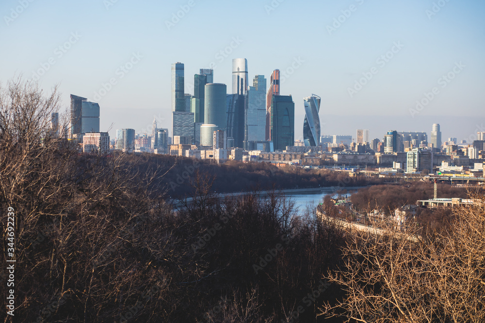 Sunny super-wide angle view from Sparrow Hills (Vorobyovy Gory), Moscow, Russia, with Luzhniki Stadium, Moscow cable car ropeway gondola, and scenery panorama beyond the city