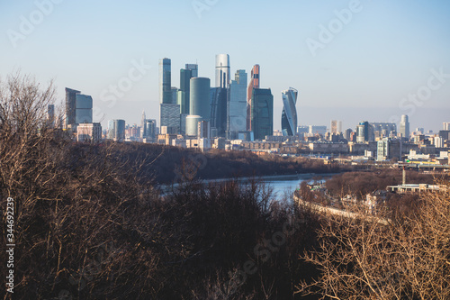 Sunny super-wide angle view from Sparrow Hills (Vorobyovy Gory), Moscow, Russia, with Luzhniki Stadium, Moscow cable car ropeway gondola, and scenery panorama beyond the city