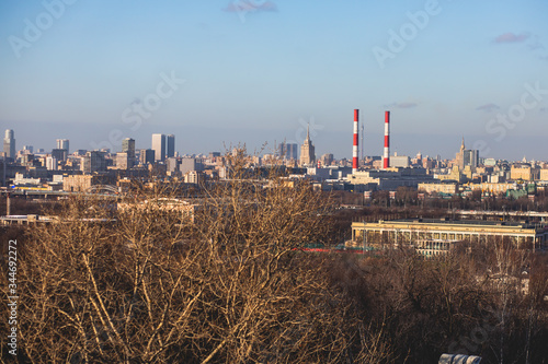 Sunny super-wide angle view from Sparrow Hills (Vorobyovy Gory), Moscow, Russia, with Luzhniki Stadium, Moscow cable car ropeway gondola, and scenery panorama beyond the city