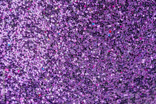 Violet sparkles close up. Bright festive background for sites and layouts