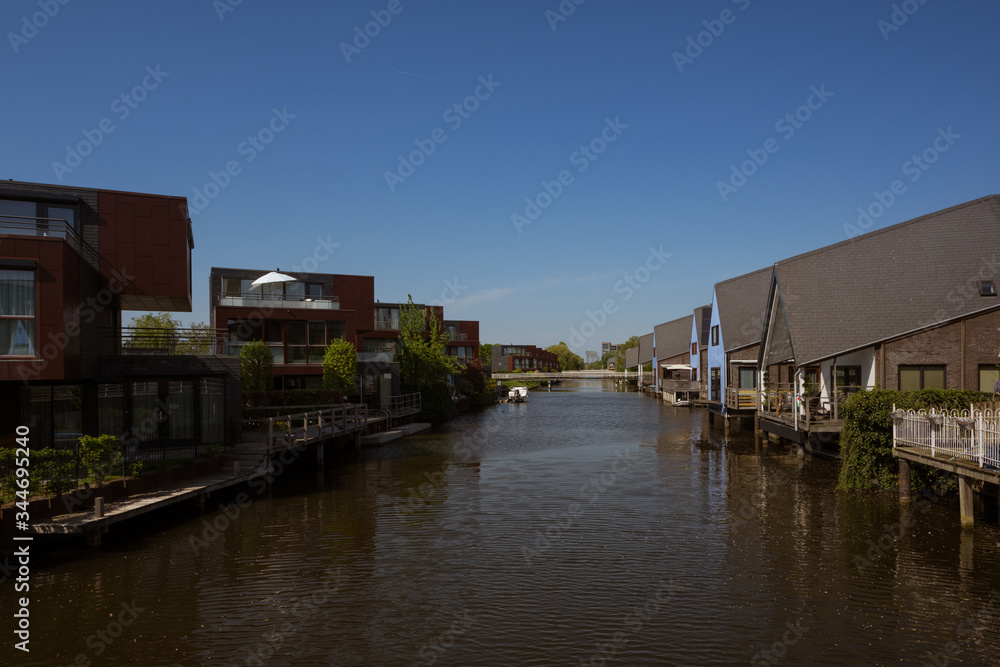 Residential buildings in a peaceful neighboorhood, on the shore of a canal