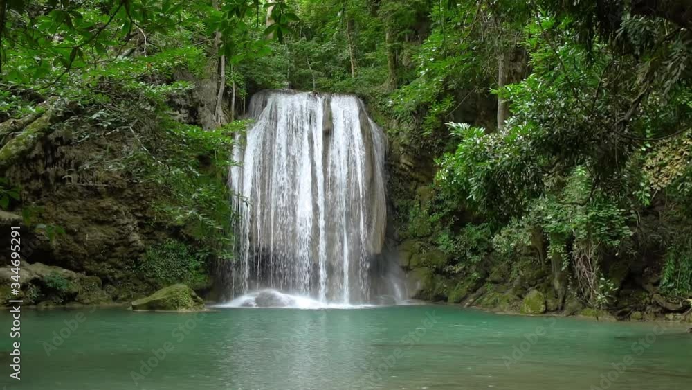 Erawan waterfall third level in National Park, famous tourist destination in Kanchanaburi, Thailand - slow motion