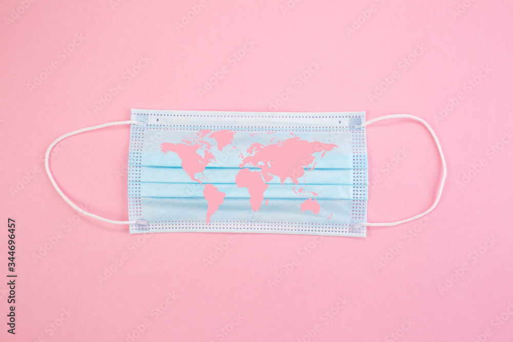 Medical protective mask on black background with Covid-19 text and World map. Surgical face mask. Chinese coronavirus outbreak concept. Medical protective mask on black background with Covid-19 text and World map. Surgical face mask. Chinese coronavirus outbreak concept.