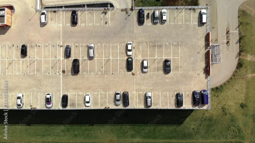 Top view of park and drive multi story parking lot in summer Top view of park and drive multi story parking lot in summer