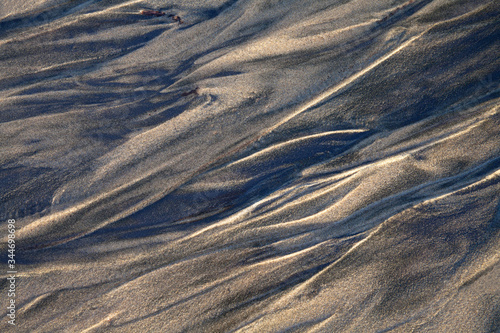 Mesmerizing sand patterns at low tide on Netarts Beach in Oregon photo