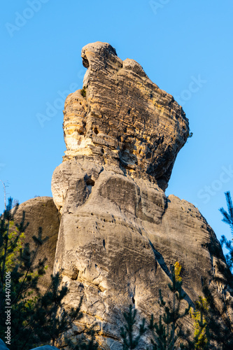 Monumental sandstone rock formation in the miidle of spring forest of Bohemian Paradise, Czech: Cesky raj, Czech Republic