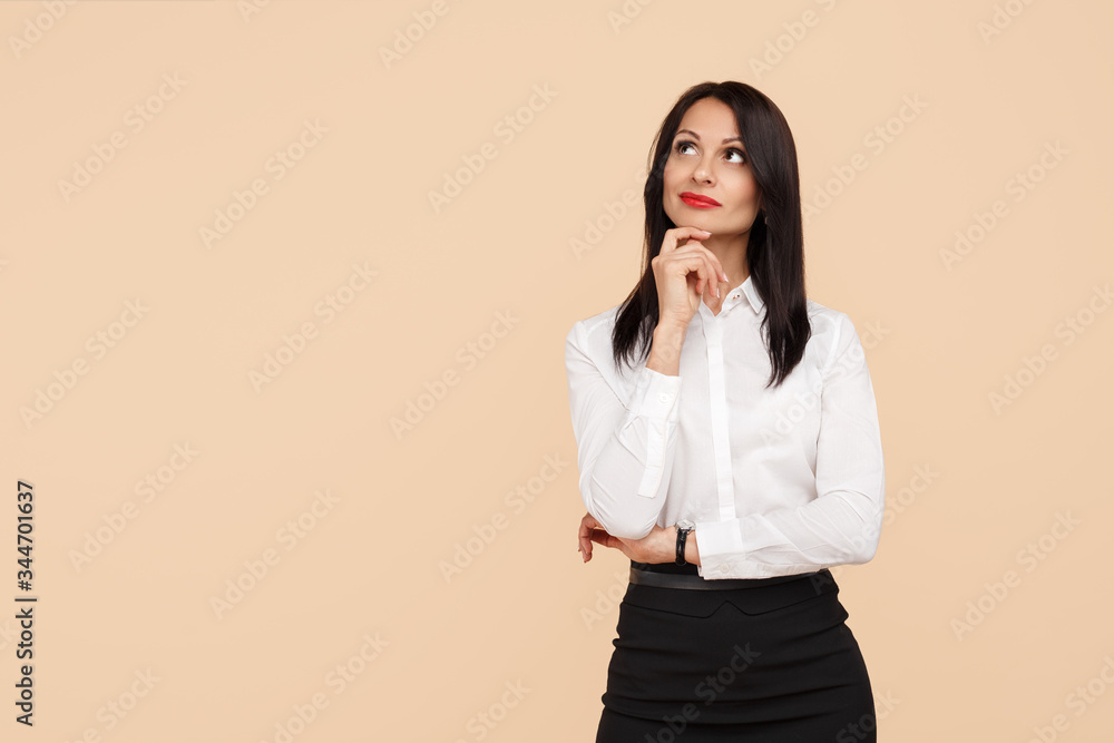 Confident strategic young modern business woman think looking up over beige background. Confident strategic young modern business woman think looking up over beige background.