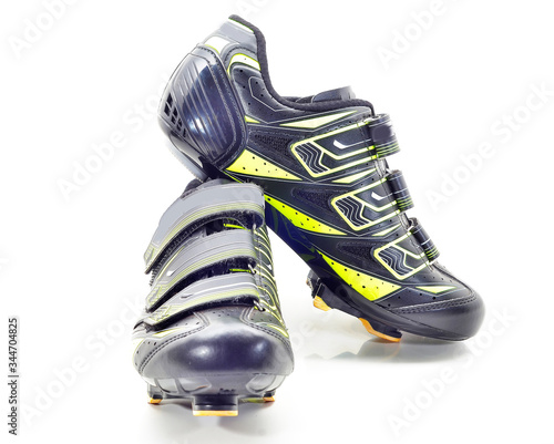 Pair of road cycling shoes on white background.
