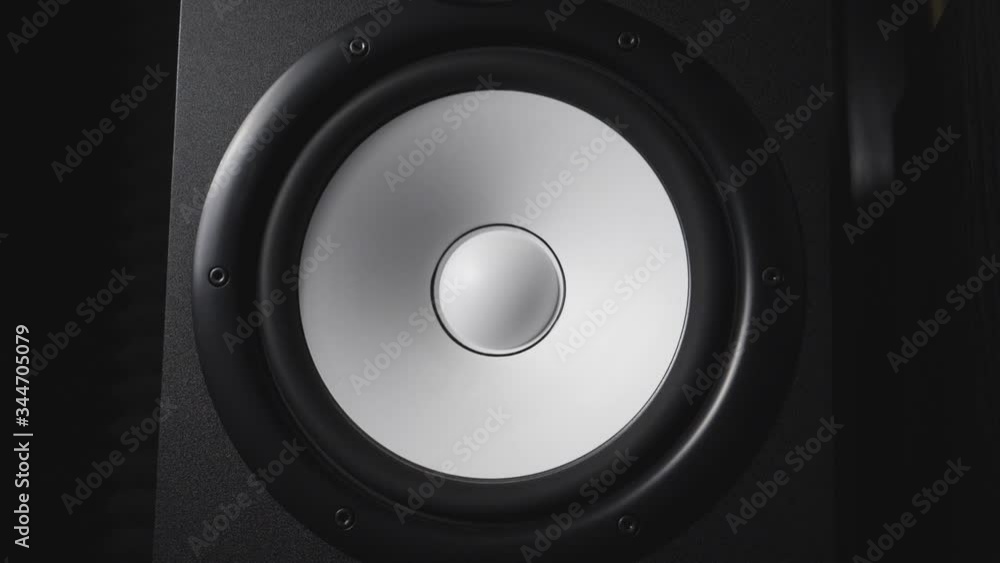 Close up of moving modern sub-woofer on recording studio. White round audio speaker pulsating and vibrating from sound on low frequency. Work of high fidelity loudspeaker membrane. Slow motion Close up of moving modern sub-woofer on recording studio. White round audio speaker pulsating and vibrating from sound on low frequency. Work of high fidelity loudspeaker membrane. Slow motion