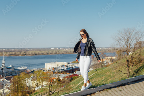 A girl in a leather black jacket and sunglasses © Julia Kiseleva