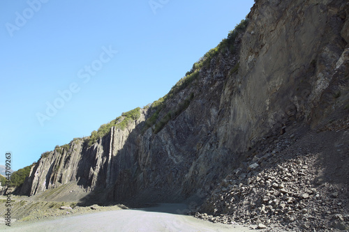 Mountainous road leading to Lahic village in Ismayilli region of Azerbaijan, with car.