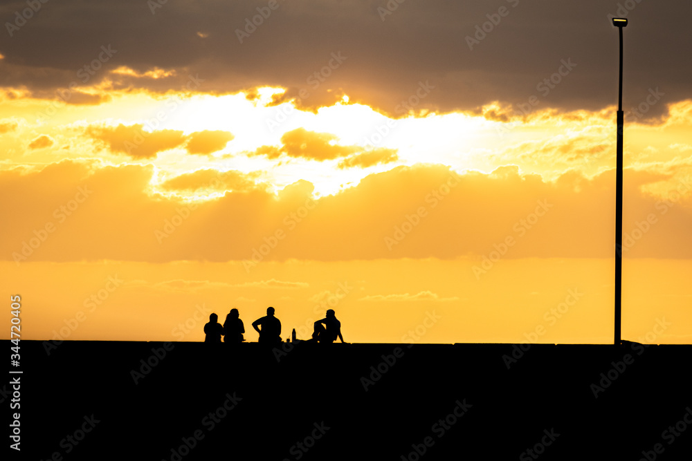 silhouette of family on the beach