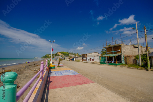 Esmeraldas, Ecuador - March 16, 2016: Stoned pavement road in the coast, surrounded with abundat vegetation in a sunny day in the Ecuadorian coasts © Fotos 593