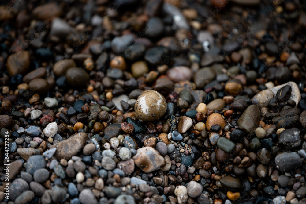 Rocks sit on the beach.