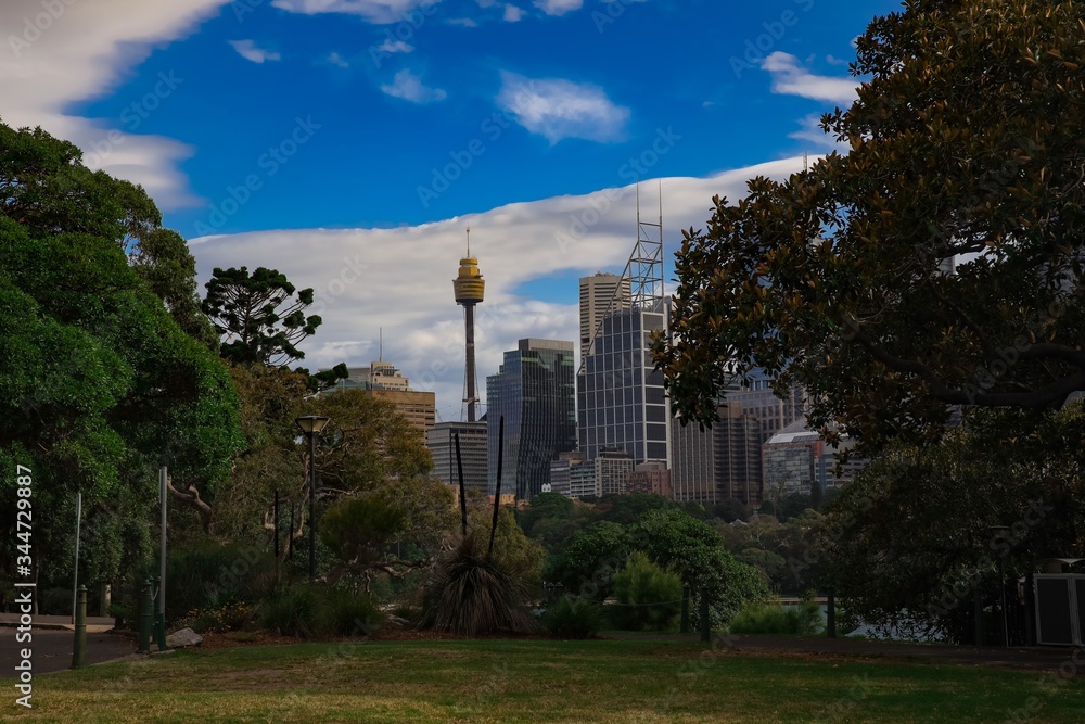 Panoramic view of Sydney Harbour foreshore on a partly cloudy and blue sky