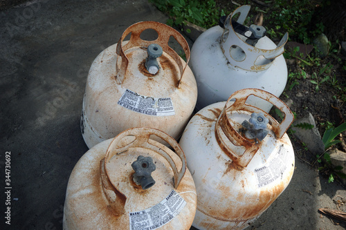 Old rusty propane tanks on patio