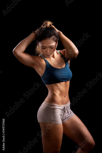 Sporty woman workout while Cropped studio shot of a stunning hot sporty body of a fitness woman