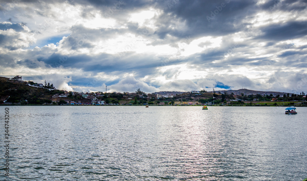 View of the Yahuarcocha lake, with a panoramic view of the city in the horizont in Yahuarcocha Ecuador