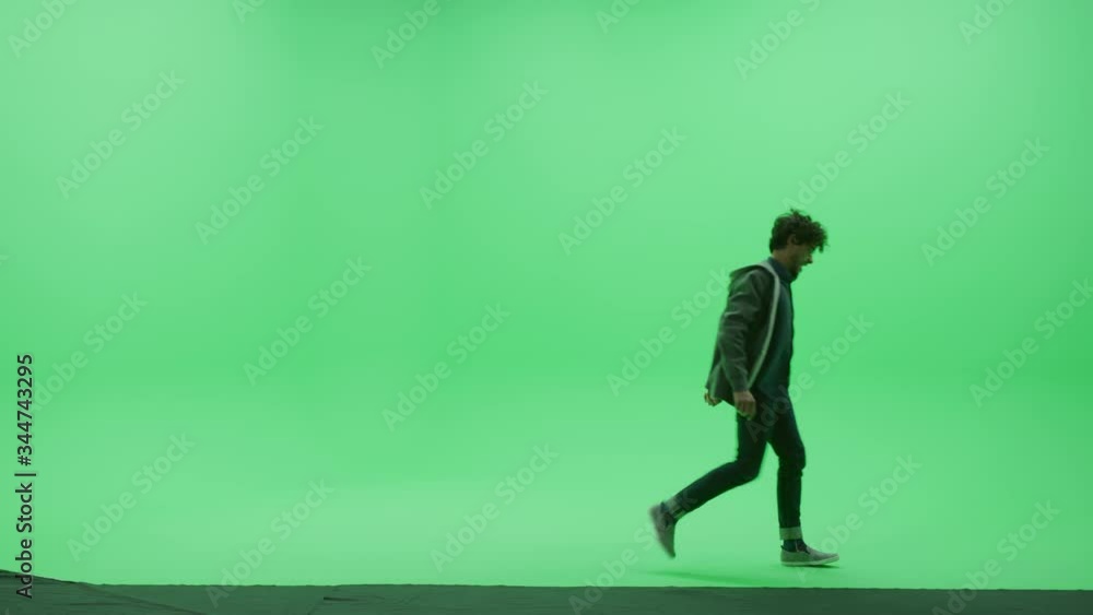 Green Screen Chroma Key Studio: Handsome Young Man Wearing Stylish Casual Clothes Dances Across Room Green Screen Chroma Key Studio: Handsome Young Man Wearing Stylish Casual Clothes Dances Across Room