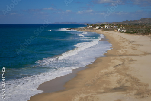 Peaceful shoreline with the surf lapping at the sand 