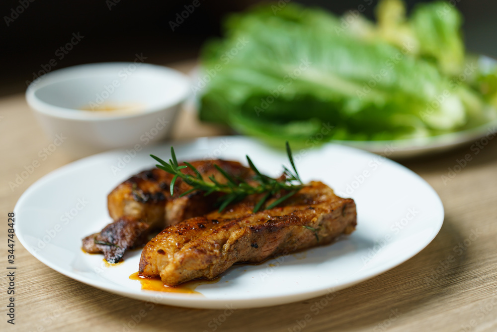 Pork juicy steak grill with vegetables and spices.