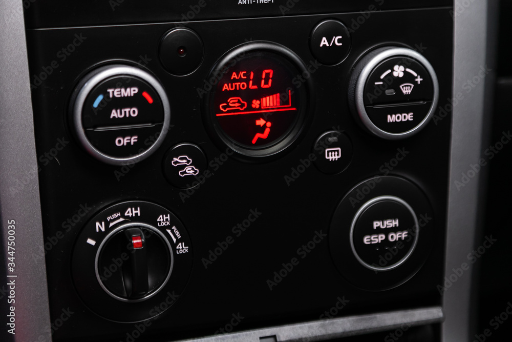 Modern black car interior: climat control view with air conditioning button, the dashboard with information about temperature inside a car. Modern black car interior: climat control view with air conditioning button, the dashboard with information about temperature inside a car.