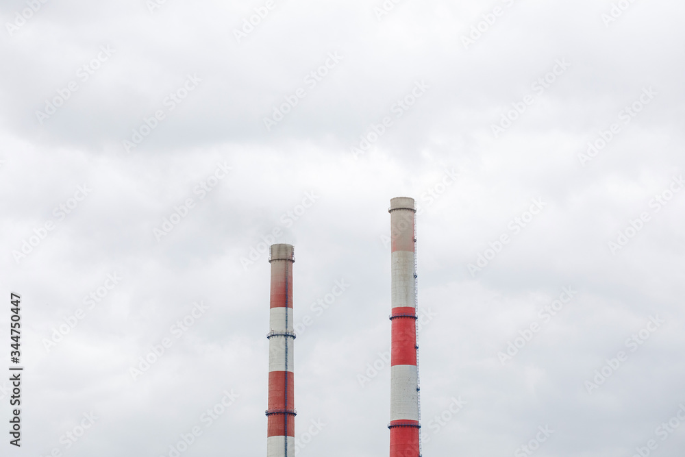 Smoking industrial chimneys in clouds. Concept for environmental protection. Smoking industrial chimneys in clouds. Concept for environmental protection.
