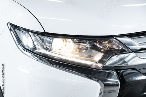 Exterior detail. Close up detail on one of the LED headlights modern car..