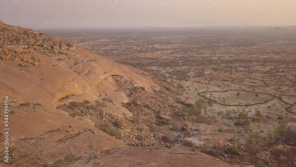 Aerial view of a traditional village in desert at sunset, Angola Aerial view of a traditional village in desert at sunset, Angola