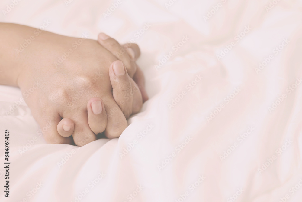 Feeling on hand of passion couple having sex. two Lover man and woman under blanket white sheets on the bed with lust and making love. concept having sexual romantic moments. Feeling on hand of passion couple having sex. two Lover man and woman under blanket white sheets on the bed with lust and making love. concept having sexual romantic moments.