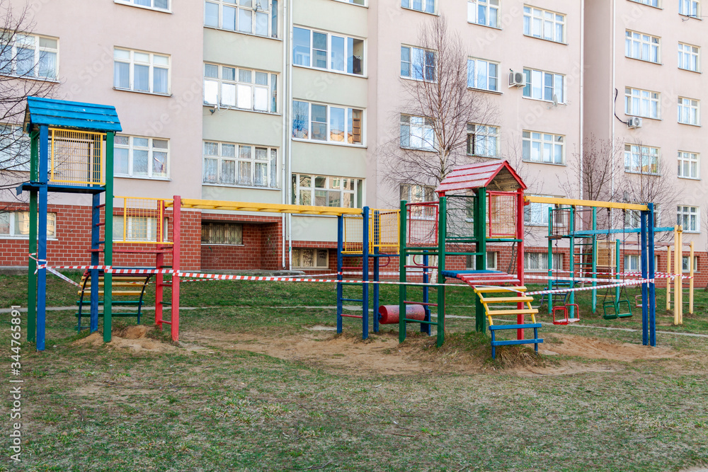 Children's playground is fenced with forbidden tape. Children's playground is fenced with forbidden tape.
