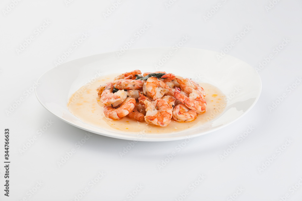 prawns in sauce on a white background prawns in sauce on a white background