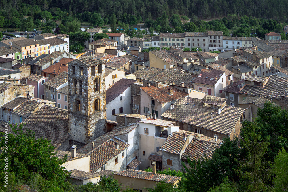 Castellane - typical french old medieval town in Provence, with tile roofs surrounded with forest