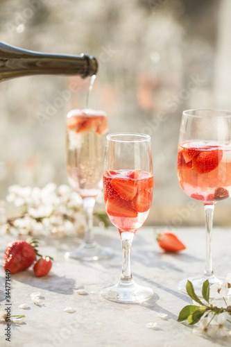 Sangria. Pink cocktail with champagne or prosecco and fresh raspberries for St. Valentine's day. photo