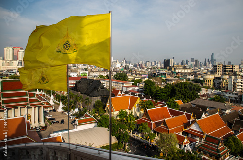 yellow King’s flag and Bangkok cityscape from Wat Saket Ratcha Wora Maha Wihan (Wat Phu Khao Thong, Golden Mount temple), a popular Bangkok tourist attraction, Thailand photo