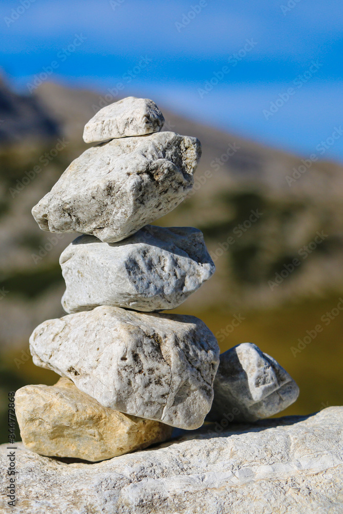 The wish stone tower on the rock and blur background.