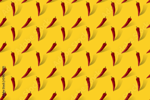 Red pepper with shadow on yellow seamless pattern. 